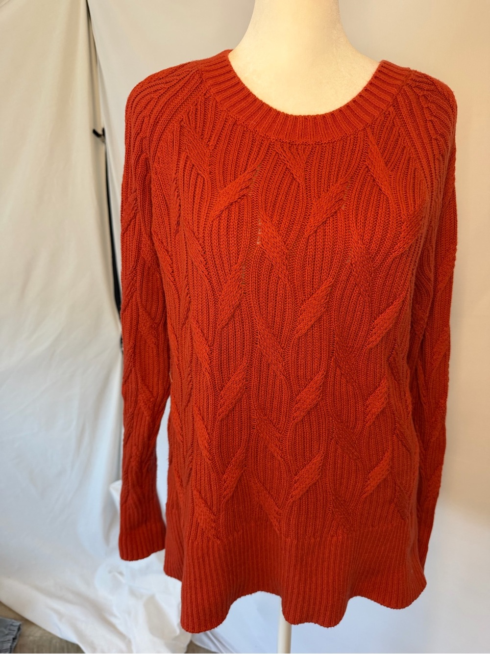 rust sweater, cable knit style, split chevron  pattern in front, long sleeve